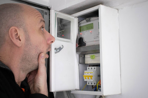 Man looking in his electrical panel